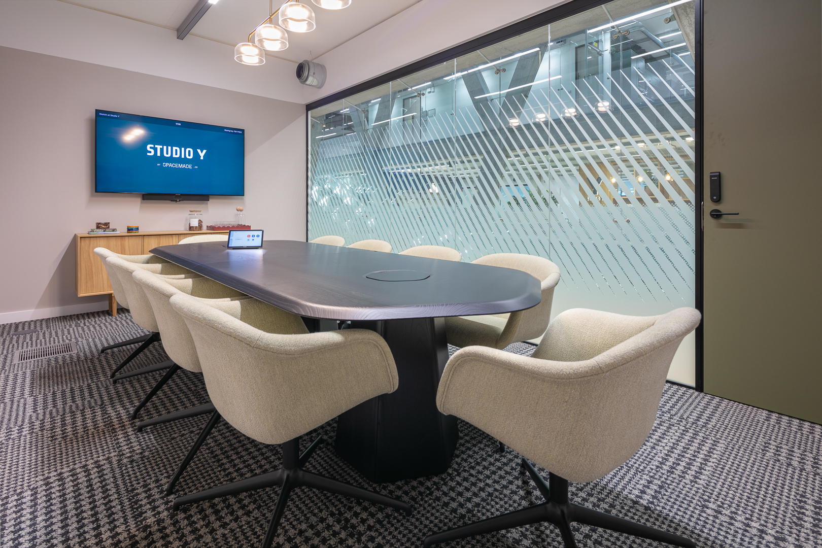 Modern Sketch boardroom at Studio Y: tech-enabled space for corporate strategy sessions.