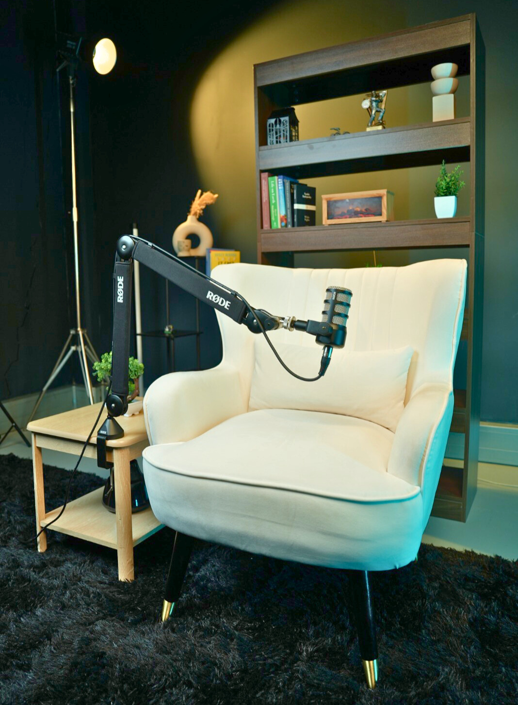 Podcast recording studio with a professional microphone and cozy armchair in London.