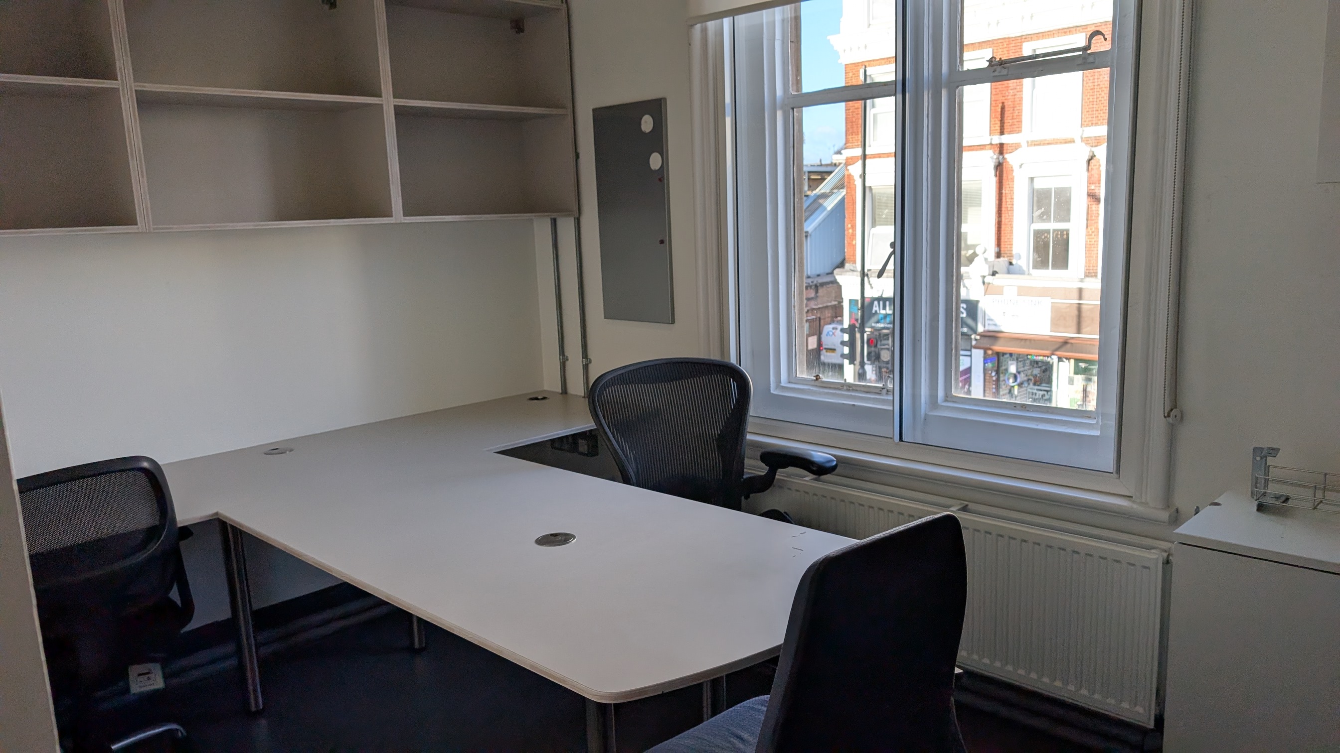 Modern meeting space in Bush Theatre with large table, ideal for workshops and meetings.