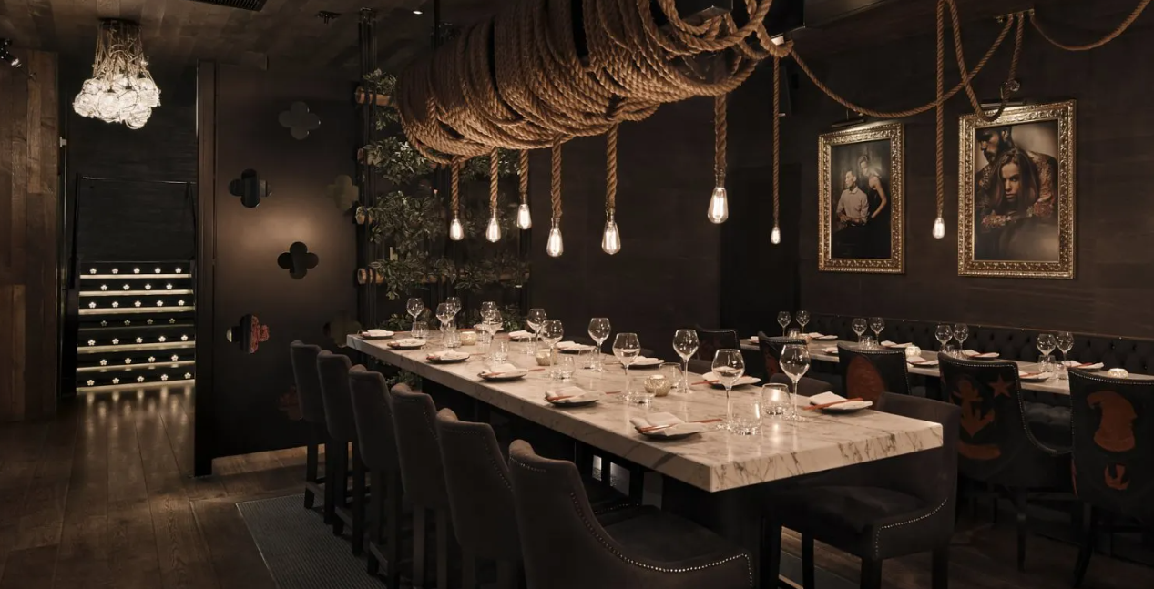 Moody Tattu private dining room with industrial lighting for exclusive corporate and gala events.