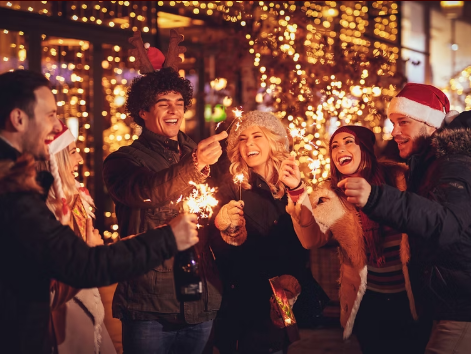 Outdoor holiday corporate mixer at The Residence Bar & Kitchen with ambient festive lighting.