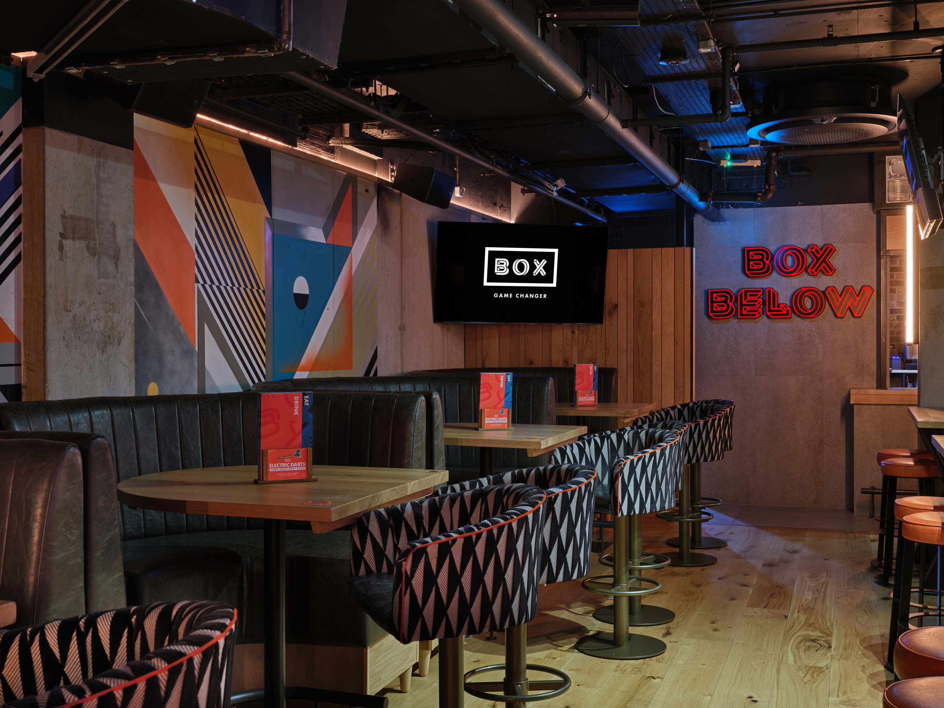 Modern event space at BOX Below with chic furniture for networking and gatherings.