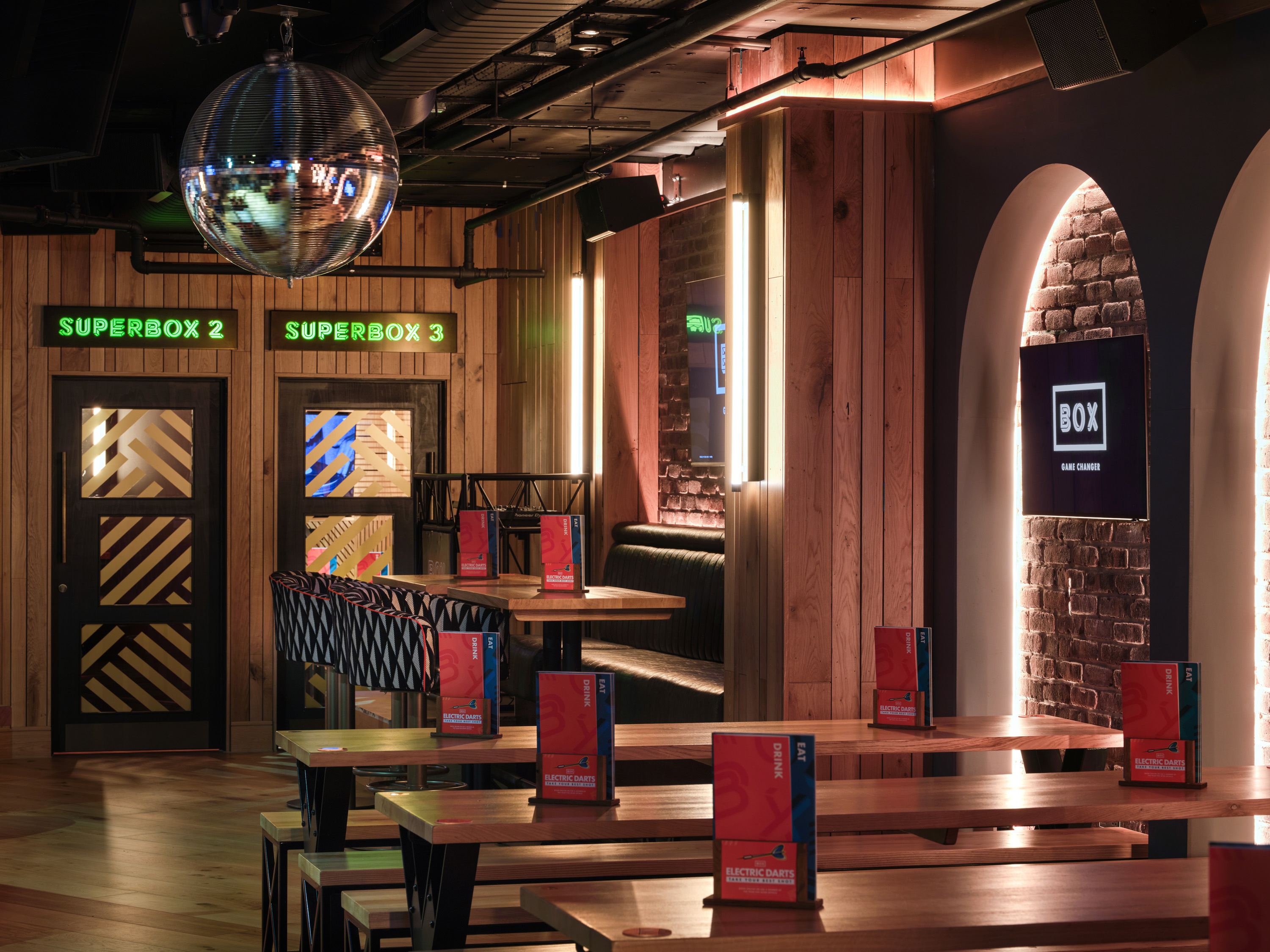 Modern event space at BOX Piccadilly, with vibrant lighting for gatherings and meetings.