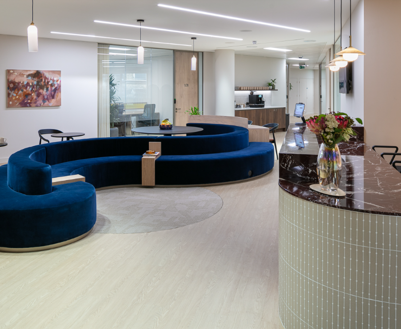 Luxury corporate pre-function area with serpentine seating for networking and reception events.