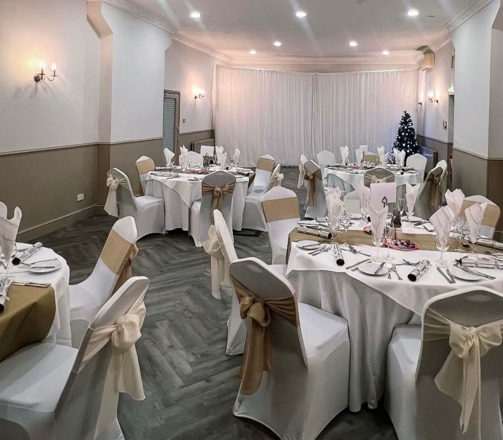 Yarm Suite dining area with white linens, perfect for weddings and corporate events.