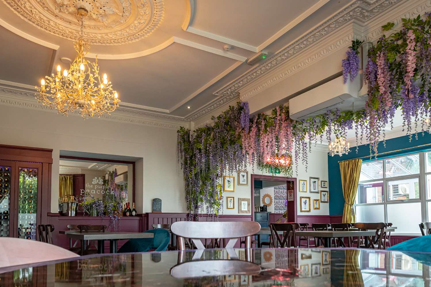 Yarm Suite event space with elegant chandeliers for intimate gatherings or meetings.