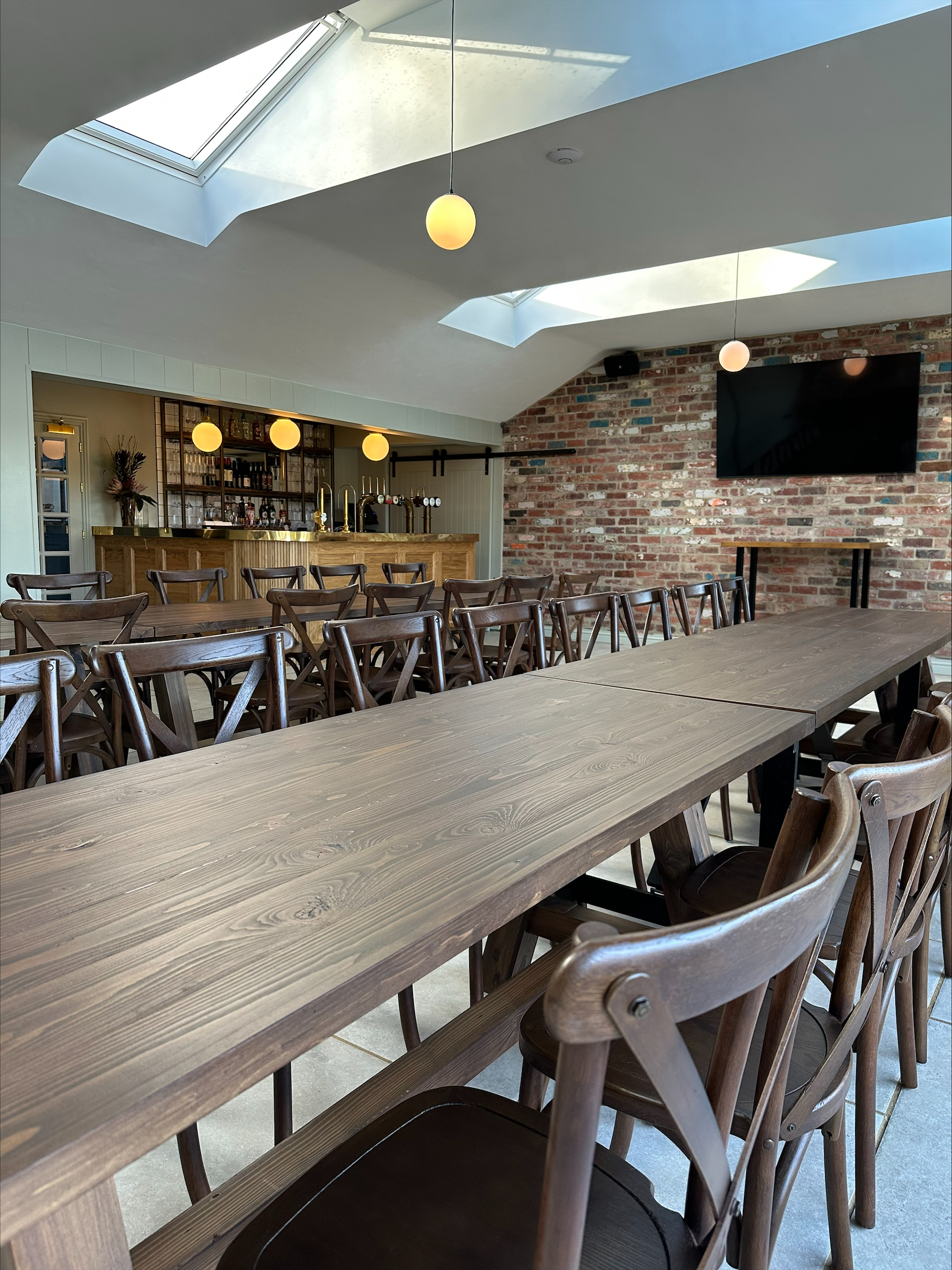 Versatile event space with wooden design for seminars and receptions at The Spotted Dog.