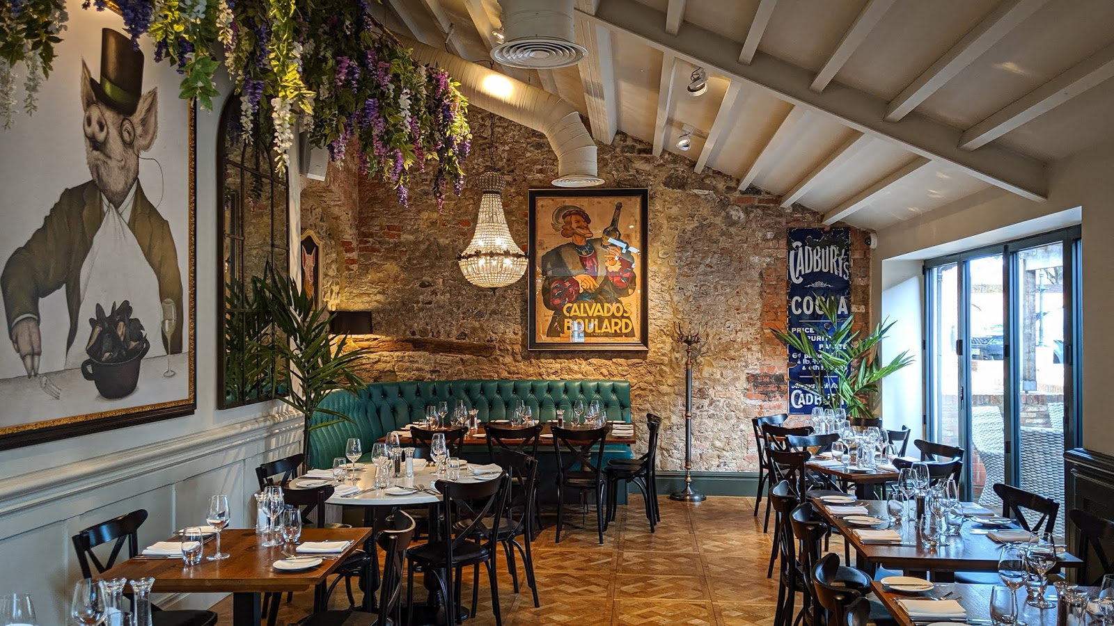 Private dining room with rustic stone walls for premium events and networking dinners.