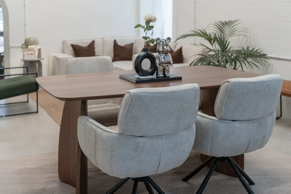Stylish Content Studio meeting space with modern table and plush chairs for collaboration.