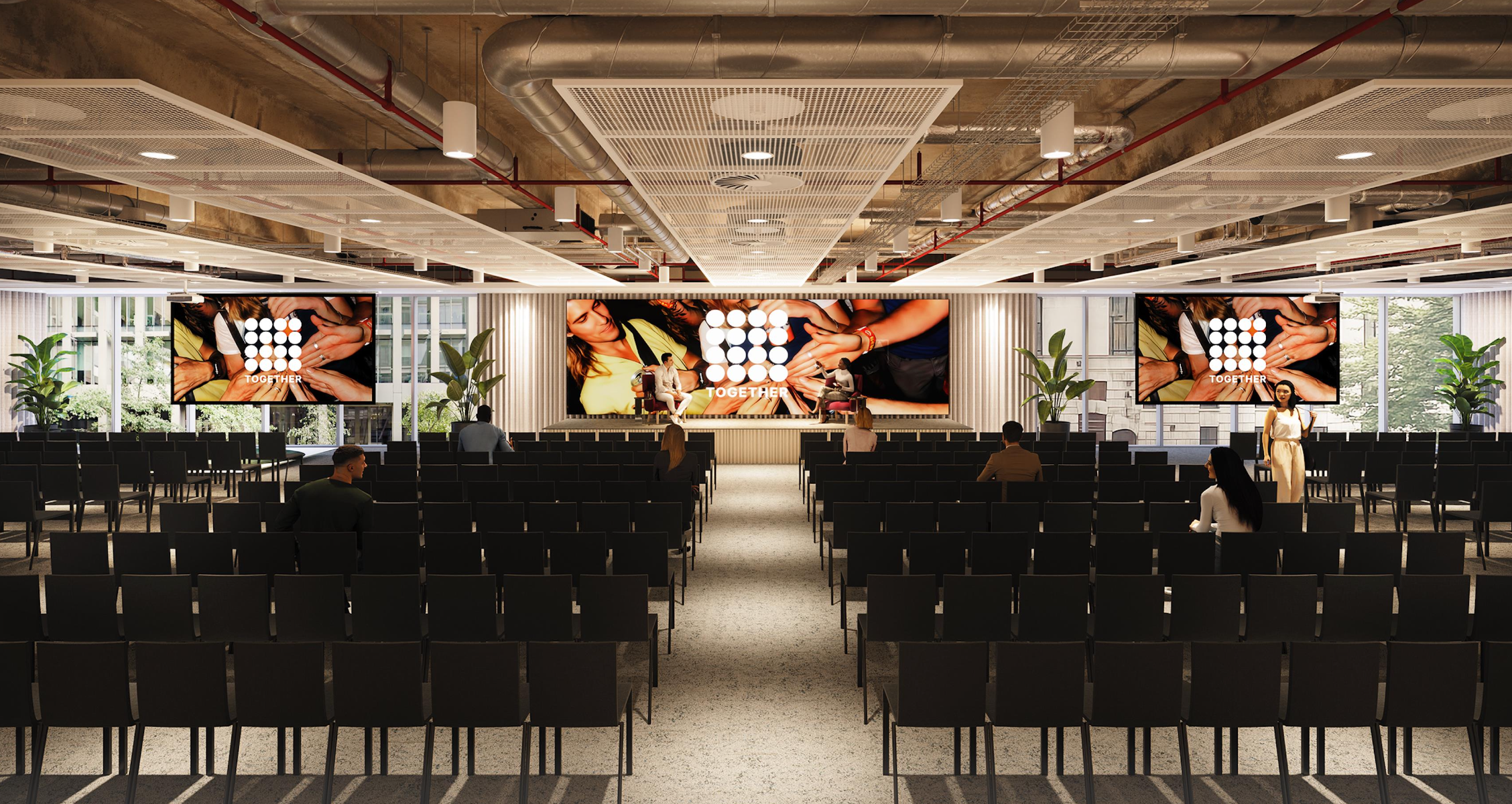 Auditorium Room at Together 88: modern conference space with seating and large screen.