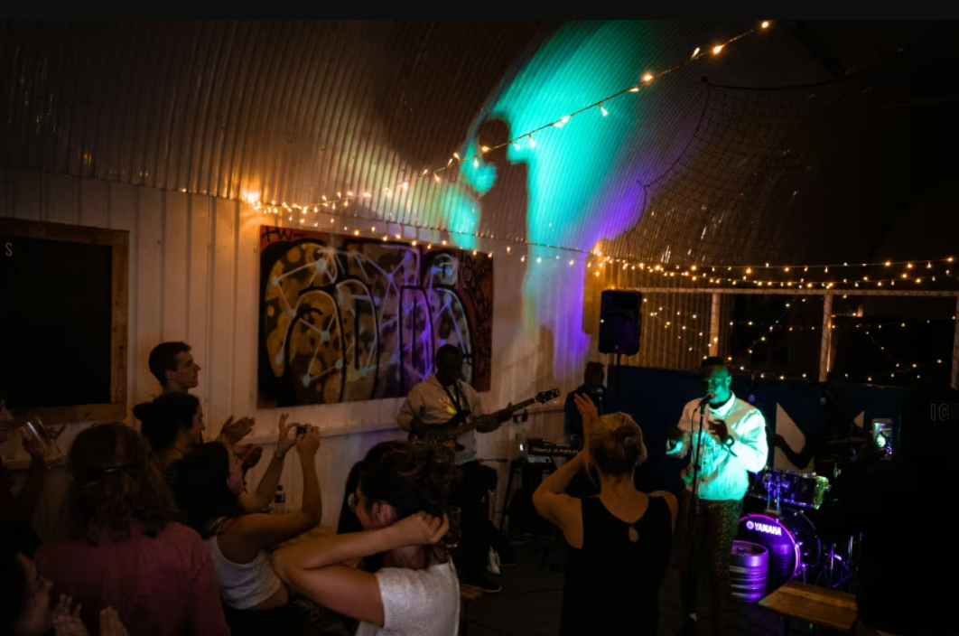 Vibrant event space at Whole Pub, Hoxton with live music and lively audience engagement.