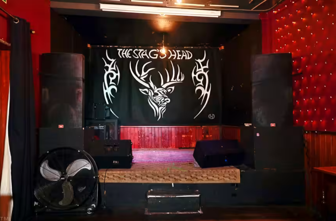 Whole Pub stage in Stag's Head Hoxton with sound speakers, perfect for live performances.