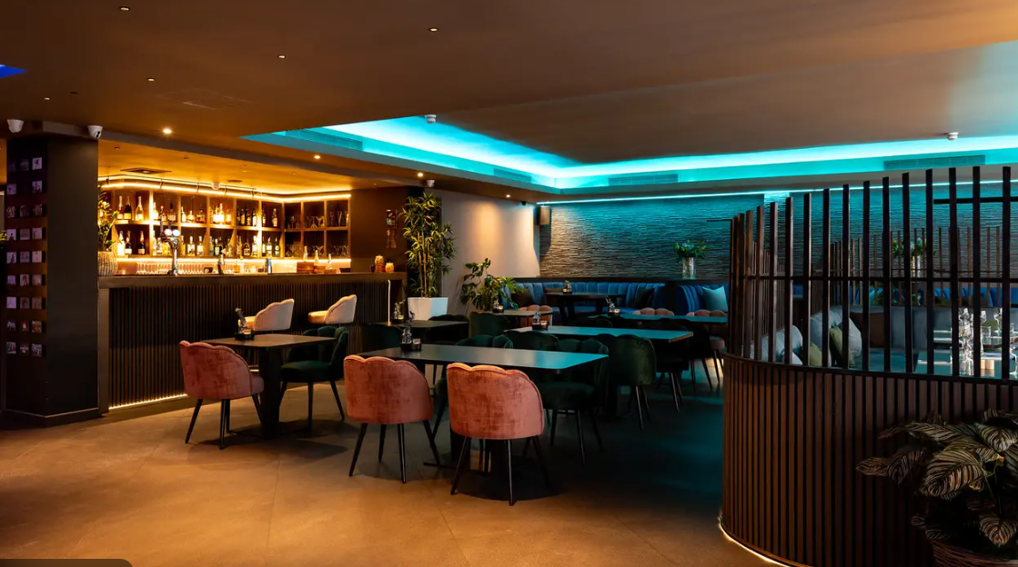 Modern Embassy Lounge Bar, warm lighting, ideal for networking events and private gatherings.