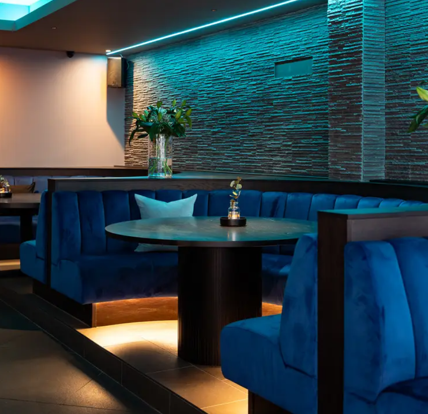 Stylish seating area at Embassy Lounge Bar for networking and meetings.