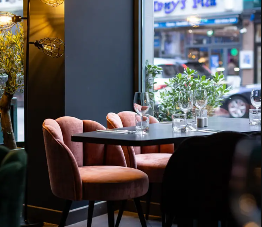 Stylish dining setup at Embassy Lounge Bar, perfect for intimate networking events.