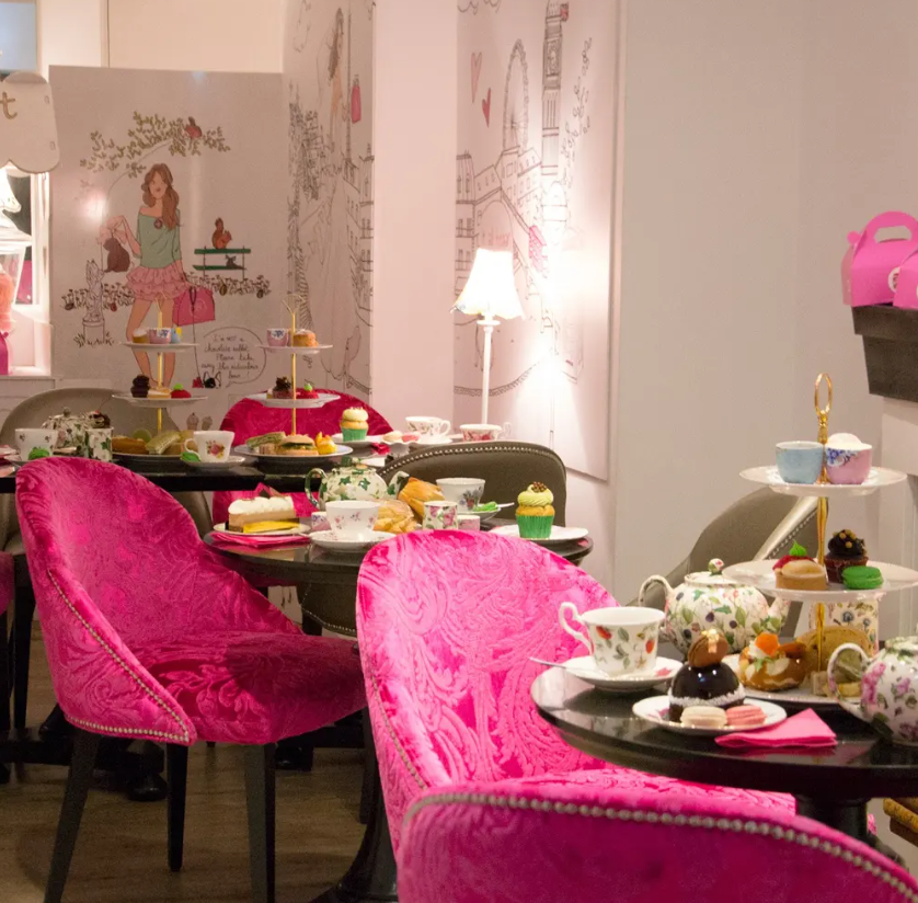 Chic pink furniture in Brigit's Bakery, perfect for tea parties and stylish gatherings.