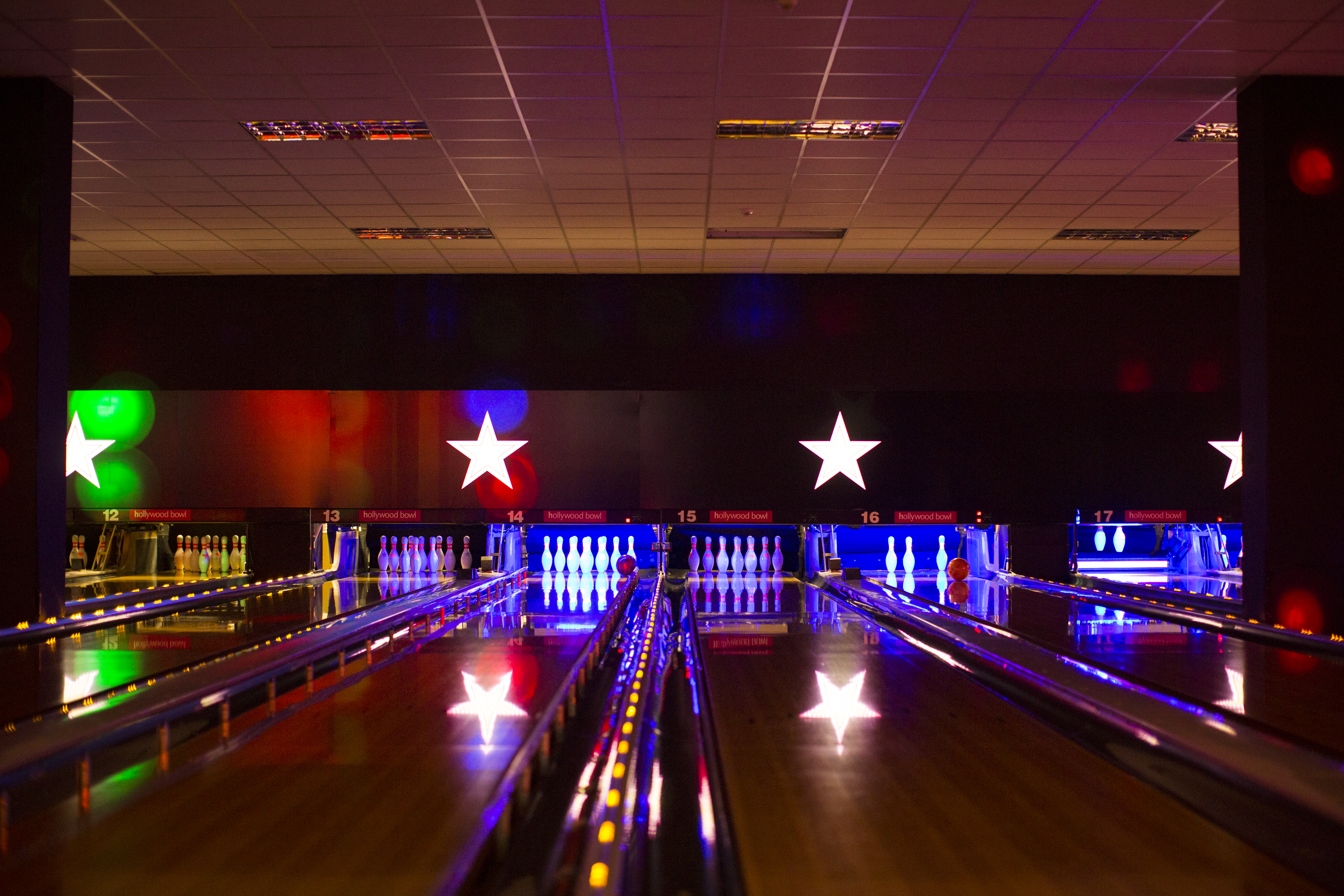 "Hollywood Bowl Birmingham with neon lights for team-building events and gatherings."
