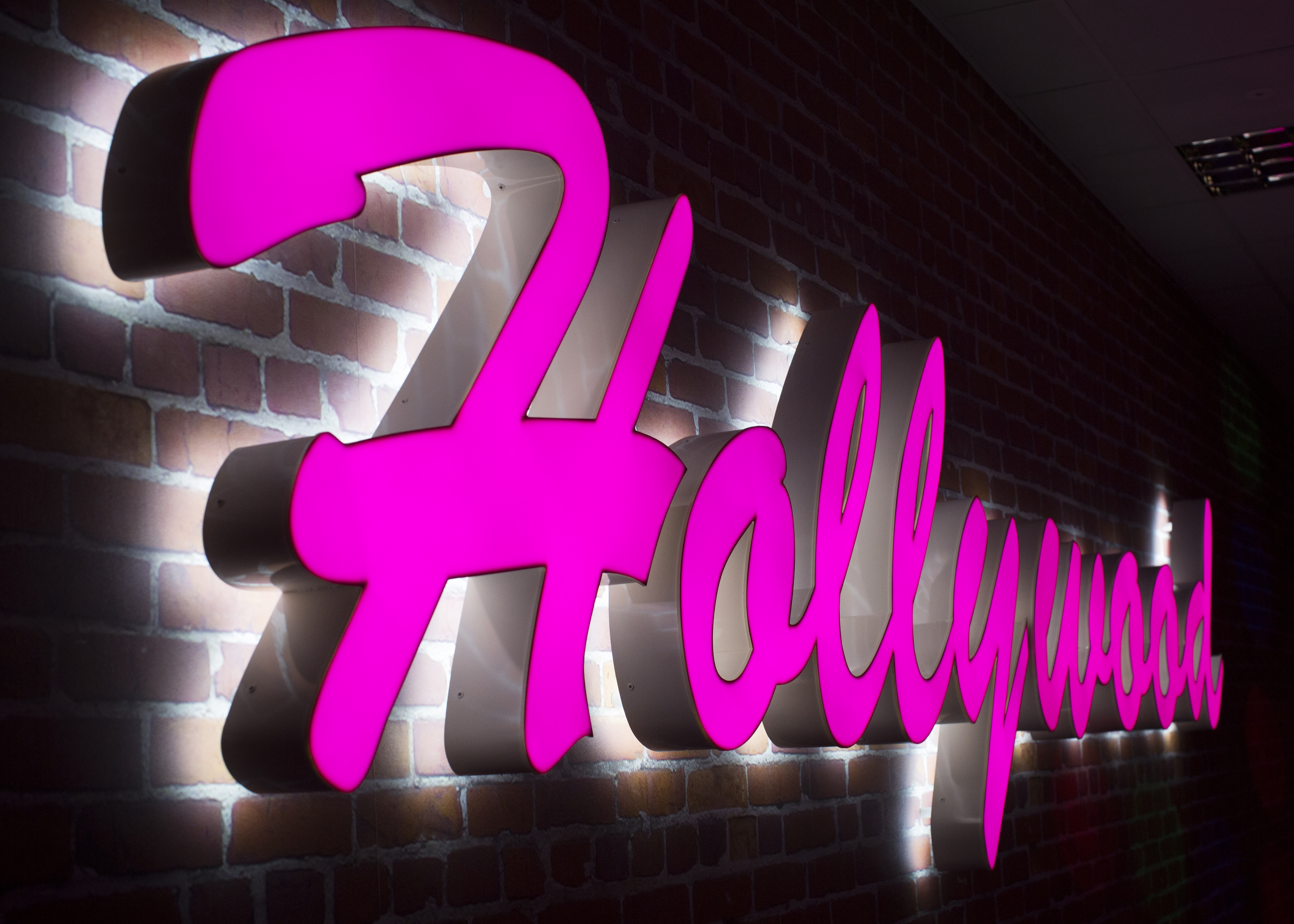 Illuminated Hollywood sign at Broadway Plaza for glamorous entertainment events.