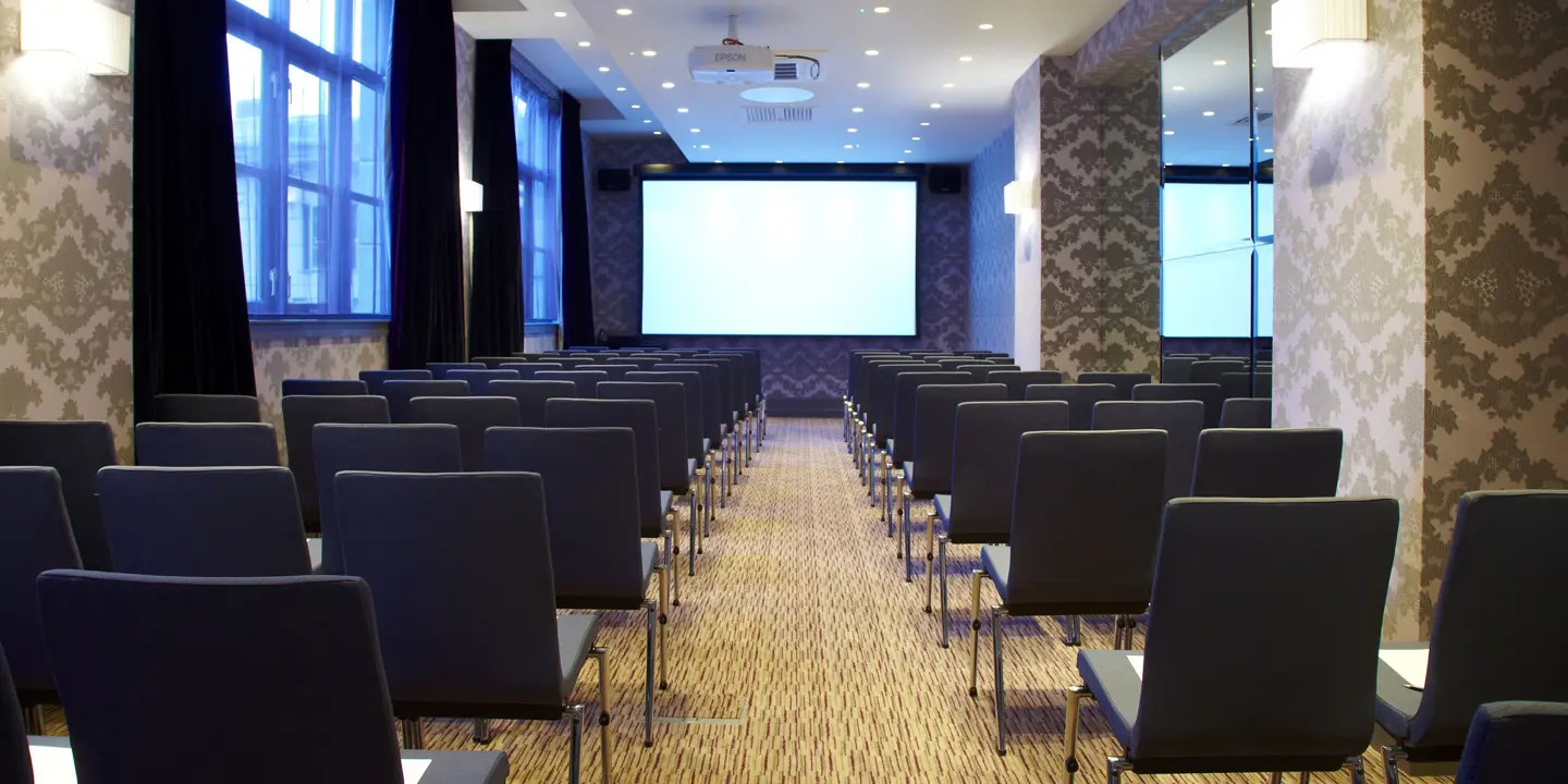 Bright meeting room with black chairs, ideal for conferences and seminars in Malmaison Newcastle.