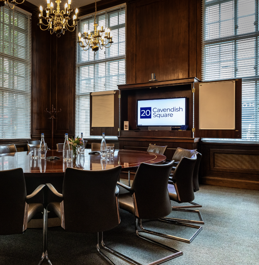 Polished Boardroom with round table, ideal for corporate meetings and events.