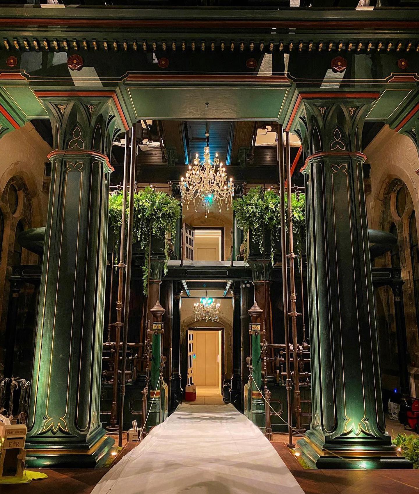 Elegant House & Enchanted Chapel event space with green columns for upscale gatherings.