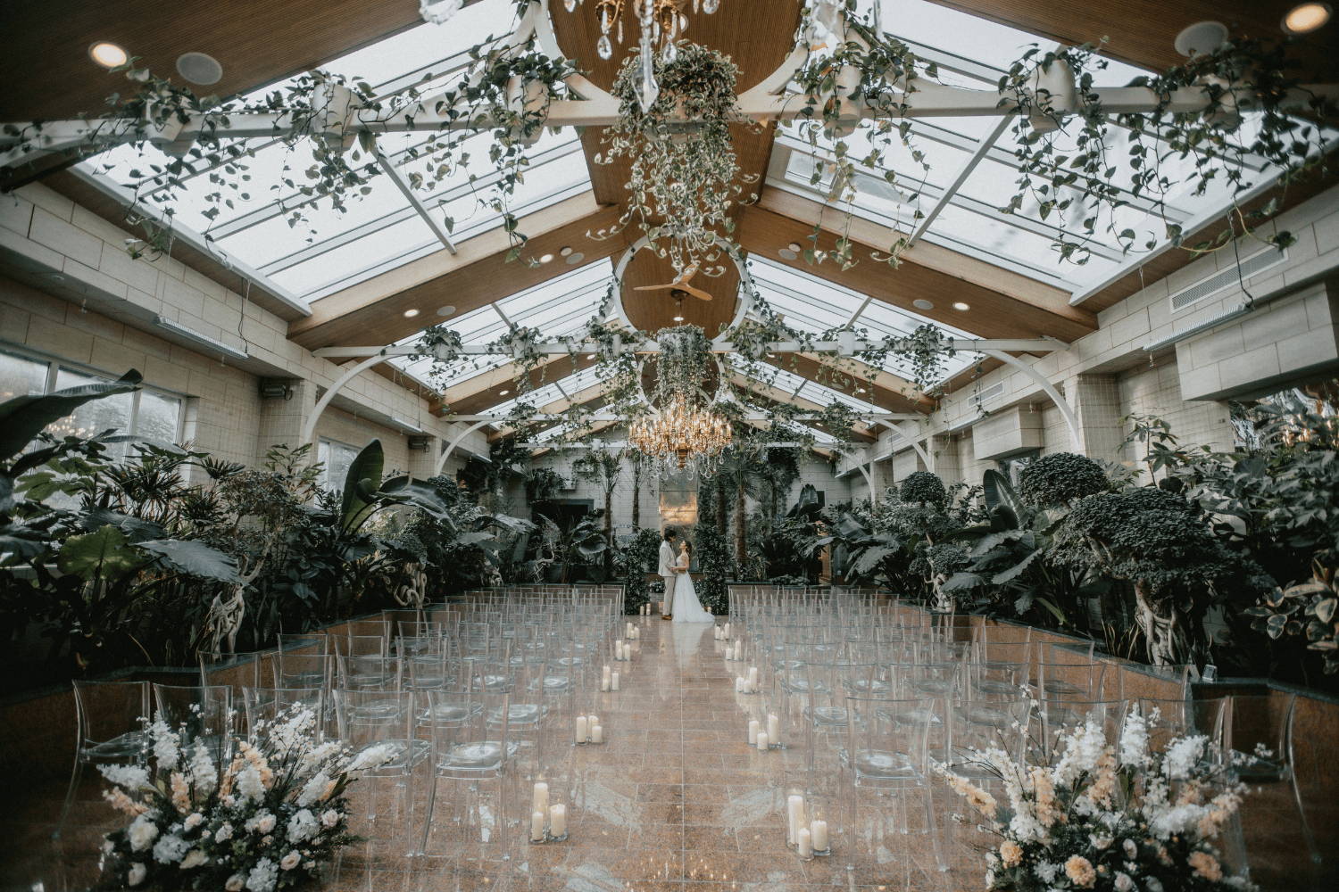 Wedding venue with clear roof, lush greenery, and elegant decor at Newton Hall.