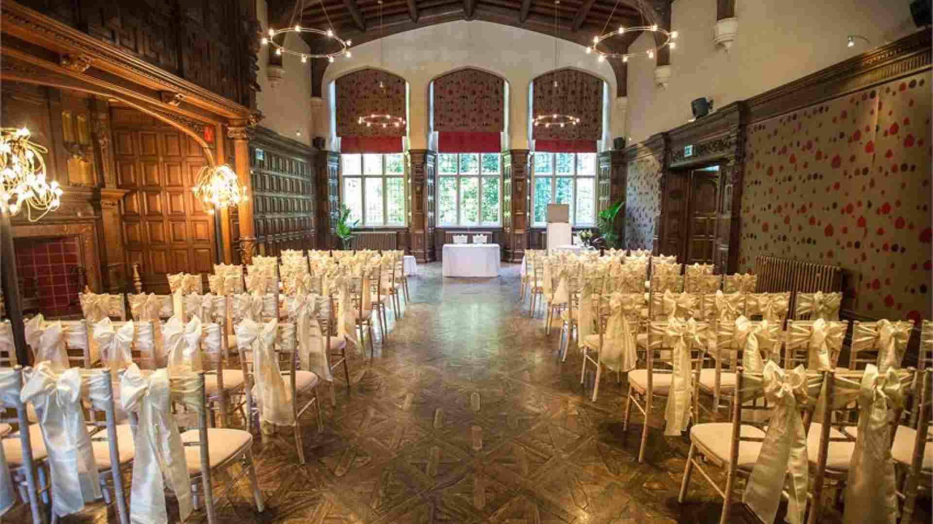 The Great Hall at Jesmond Dene House featuring wood paneling for wedding ceremonies and events.