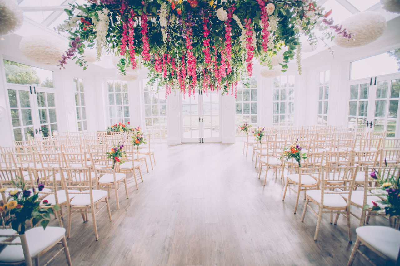 Elegant Olive House event space with floral installation, perfect for weddings and special occasions.