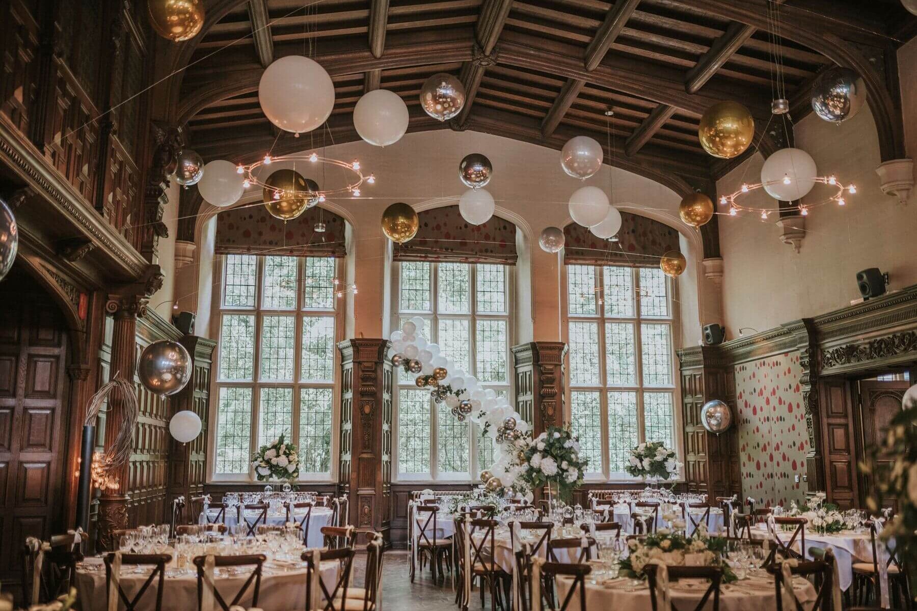 The Great Hall at Jesmond Dene House featuring balloon decor and celestial lighting for events.