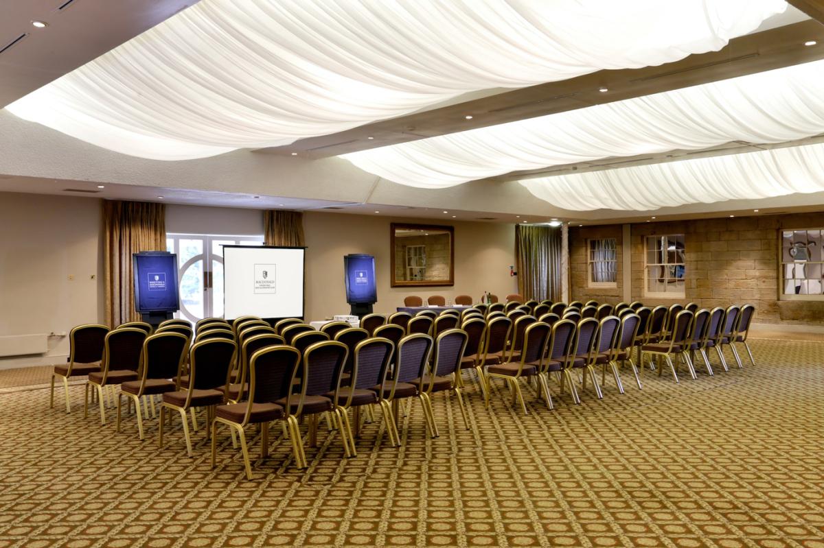 Stamfordham Suite meeting room with semicircular seating for corporate events and presentations.