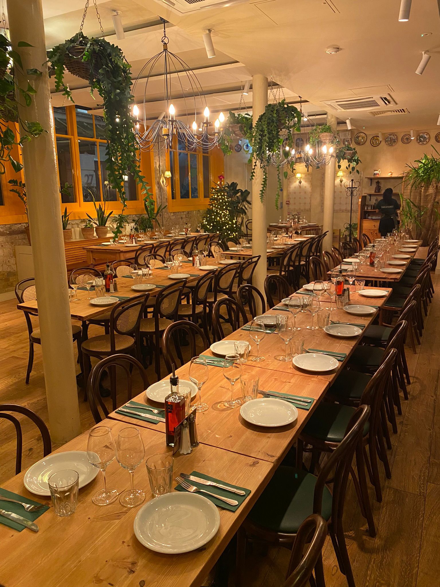 Garden Side restaurant hire with communal tables for intimate events in Casa Mayfair.