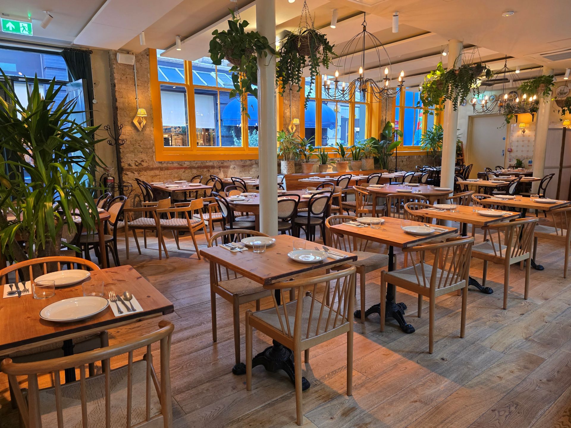 Garden Side restaurant hire in Casa Mayfair, featuring a flexible dining space and greenery.