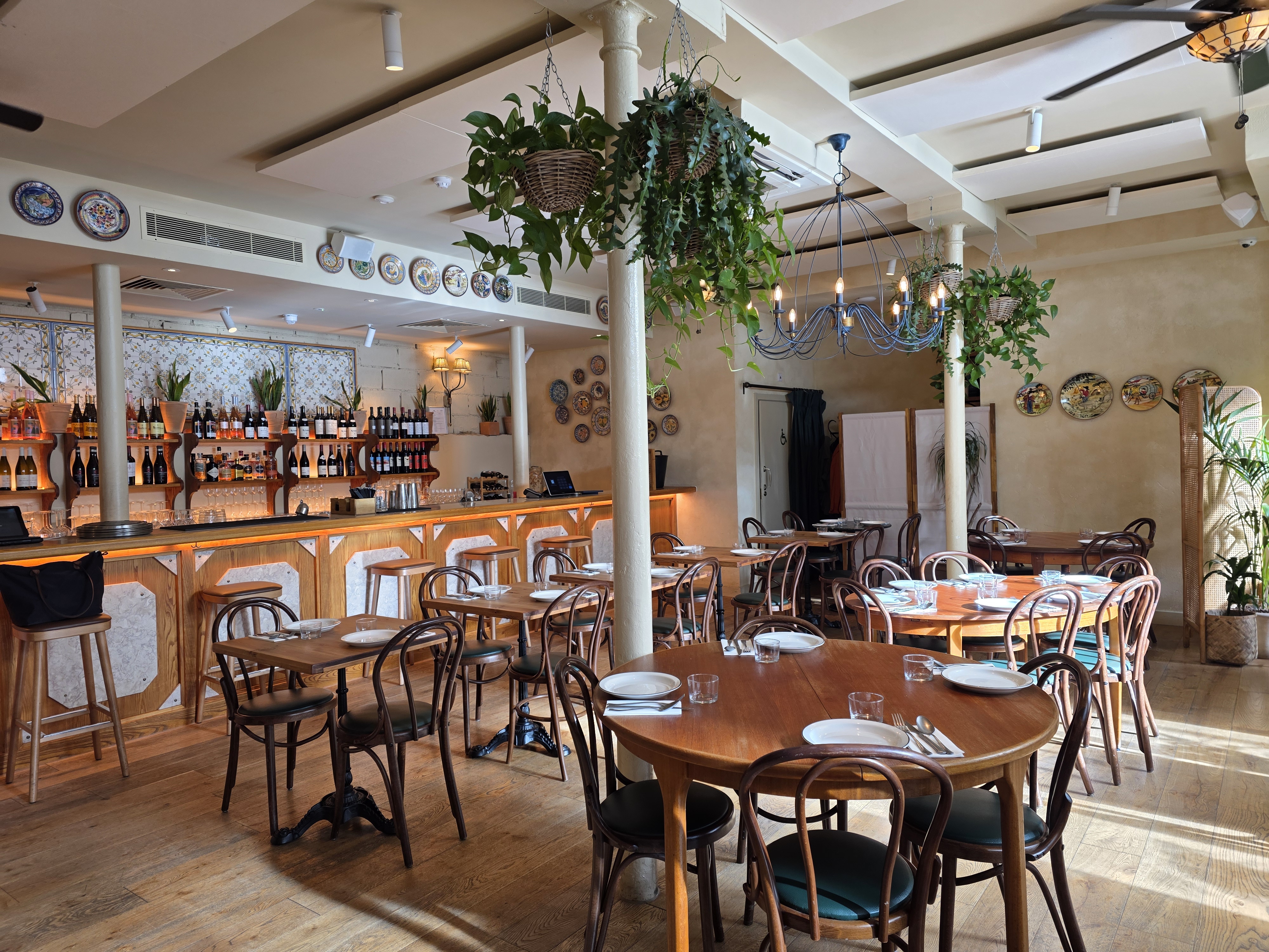 Casa Mayfair Bar Side dining space, warm ambiance, perfect for intimate gatherings and events.