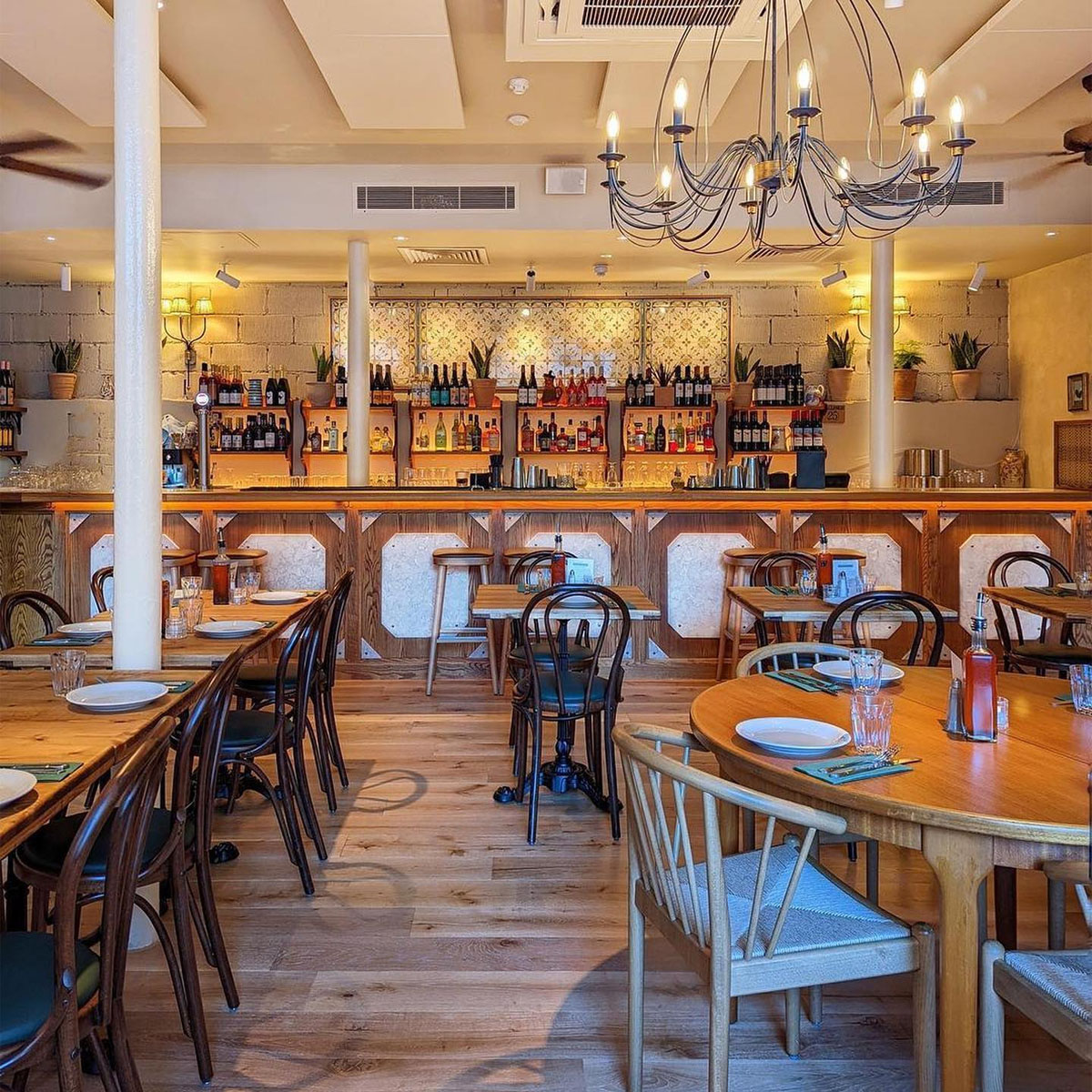 Bar Side at Casa Mayfair: cozy restaurant with warm lighting, ideal for gatherings and events.