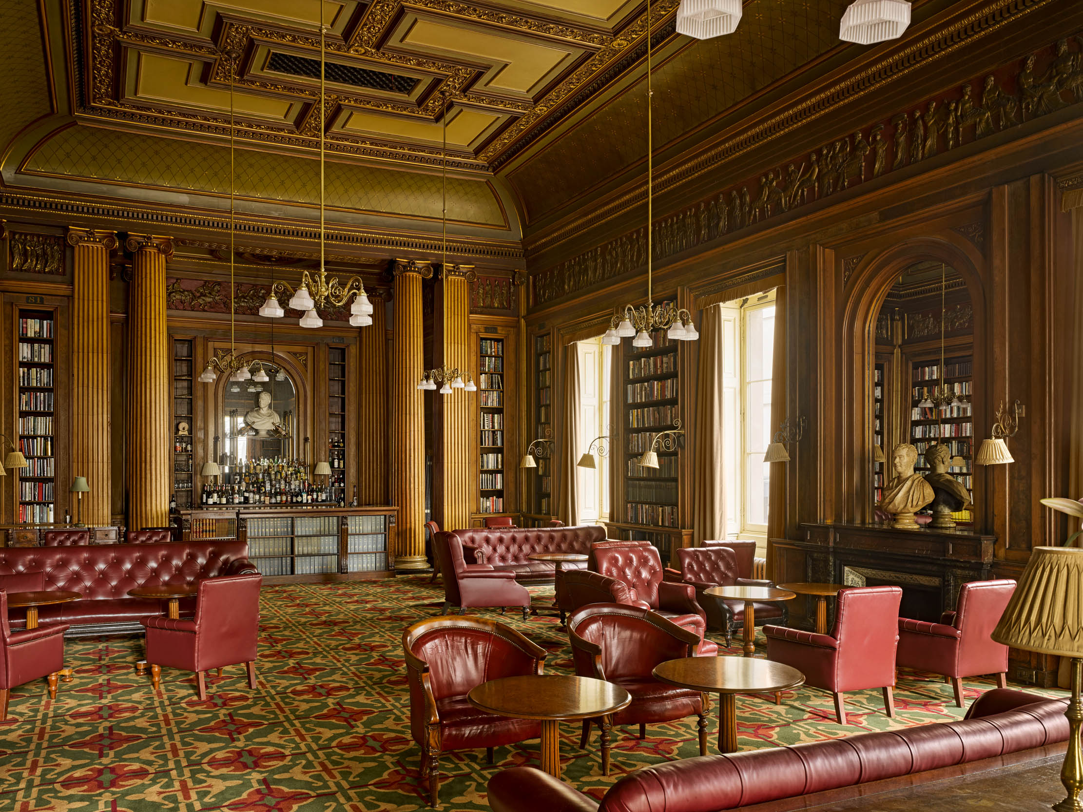Library in The Reform Club with rich wood paneling, ideal for networking events.