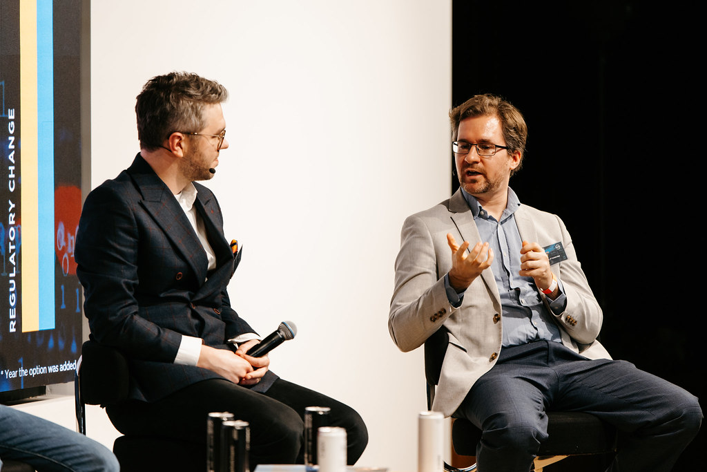 Panel discussion in Auditorium, York Road, showcasing engaged speakers and professional networking.