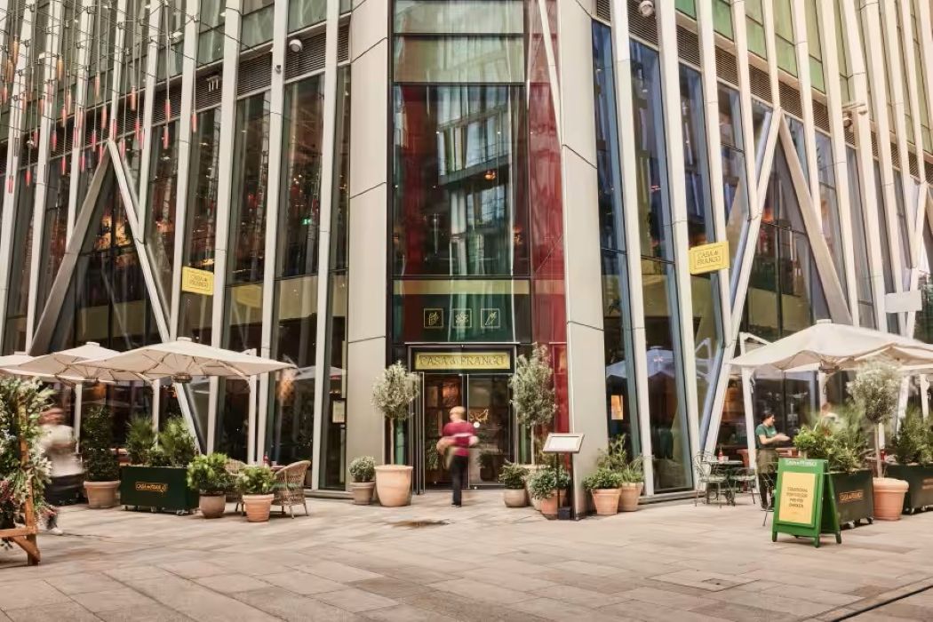 Modern venue hire at Casa do Frango Victoria, featuring glass facade and outdoor seating.