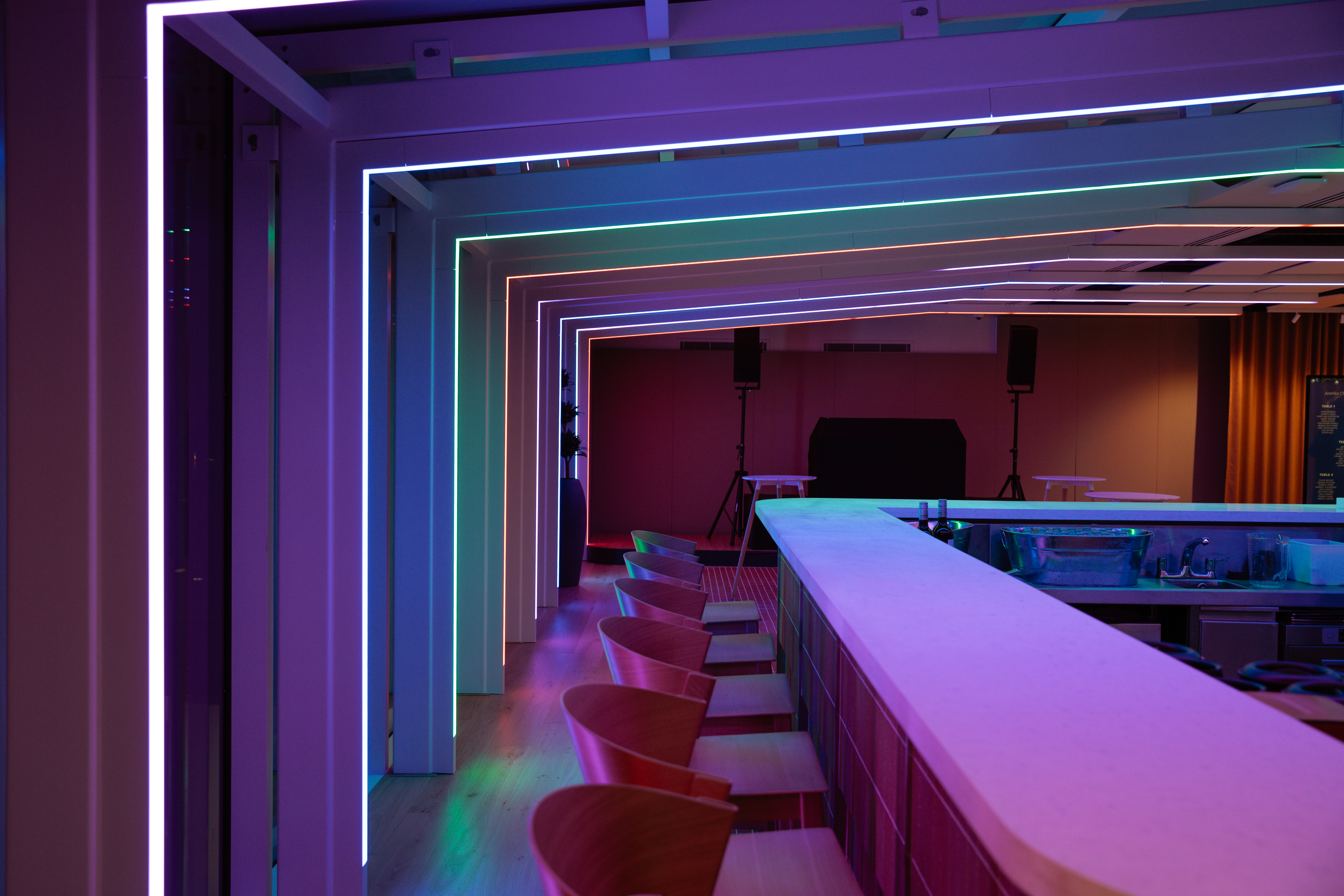 Modern event space at The View in 58VE with vibrant neon lighting for networking.