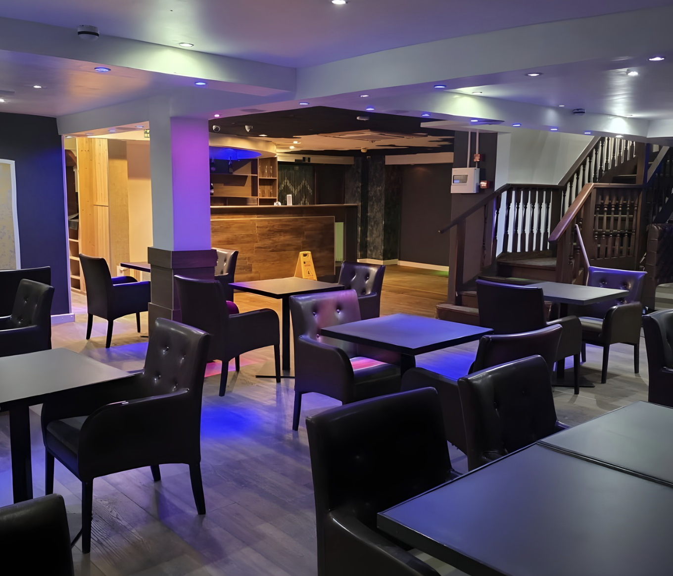 Modern event space with sleek seating, perfect for networking and conferences.