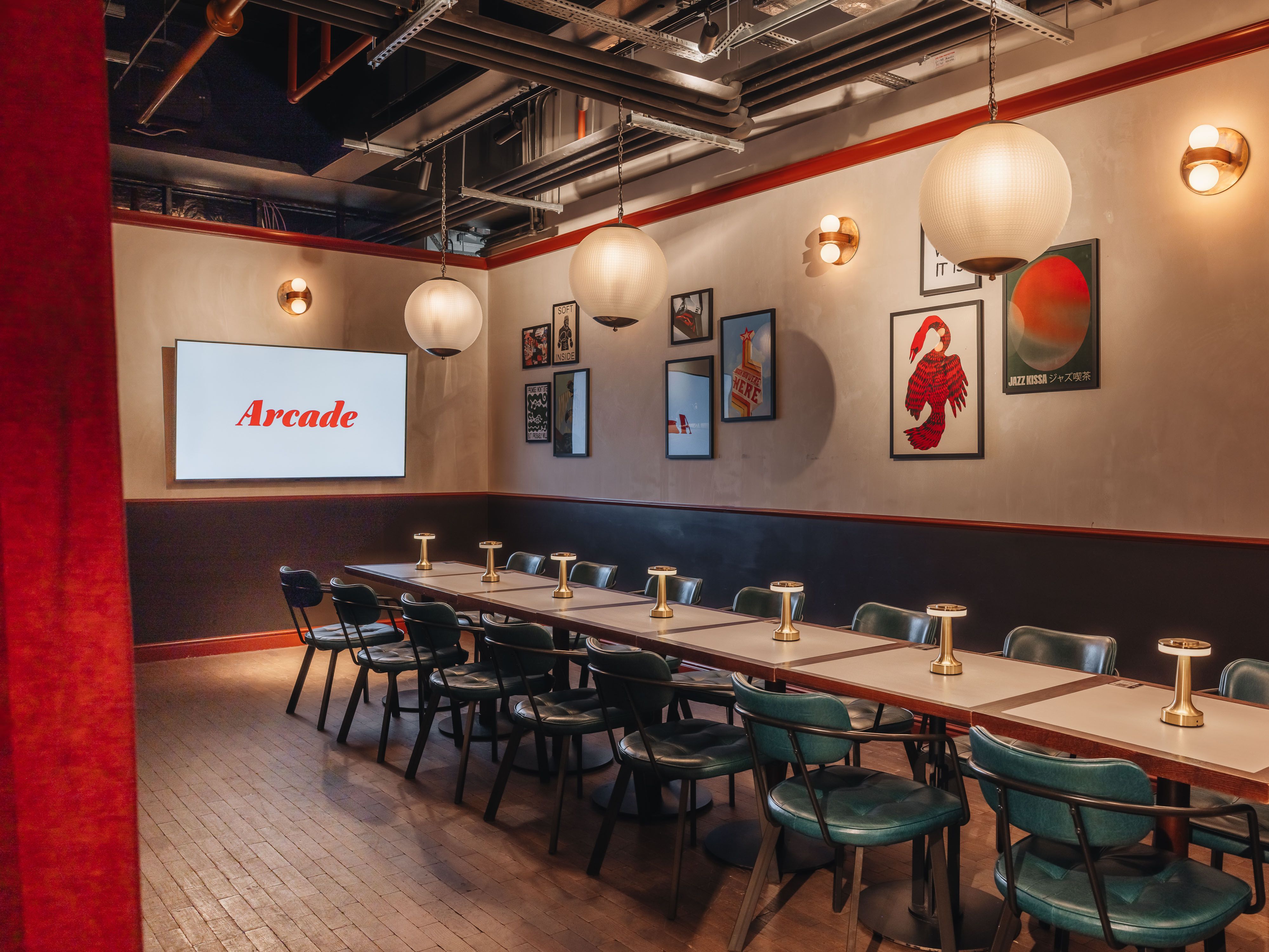 Private meeting room at Arcade Battersea with long table, ideal for corporate events and workshops.