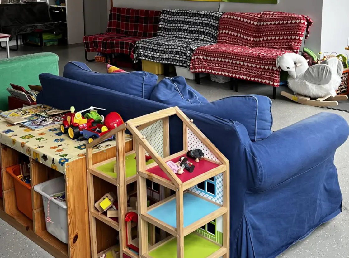 Allie Harper in cozy Ivy Street Family Centre, perfect for team-building and creative events.