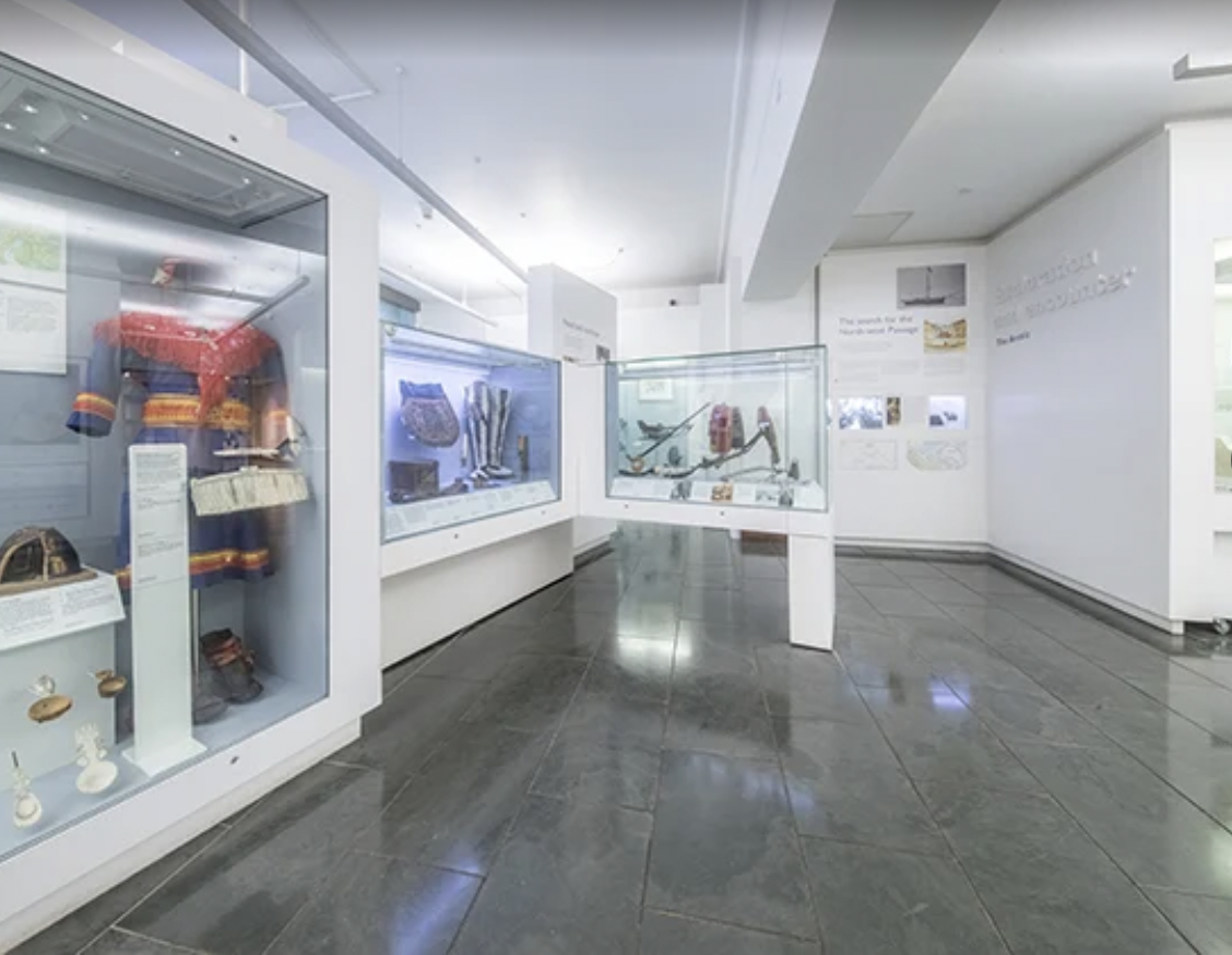 "Polished exhibition space for corporate events at Scott Polar Museum, ideal for gatherings."
