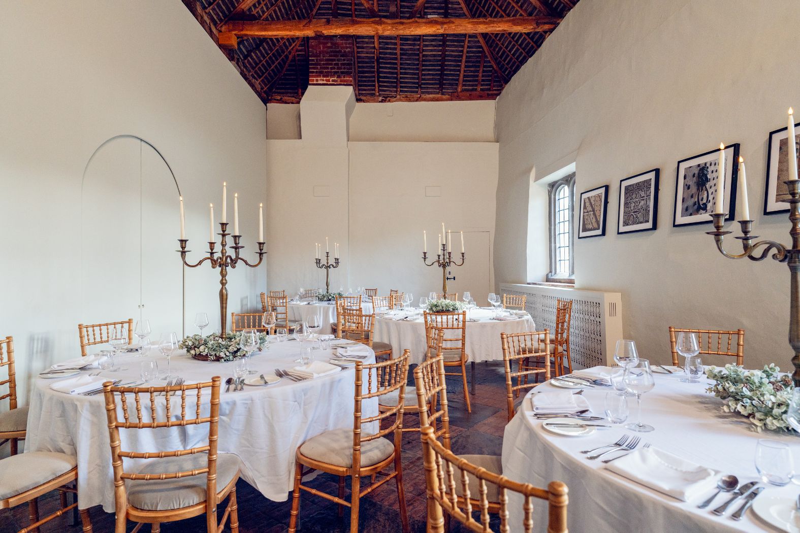 Leeds Castle Gatehouse event space with elegant tables, perfect for weddings or upscale dinners.