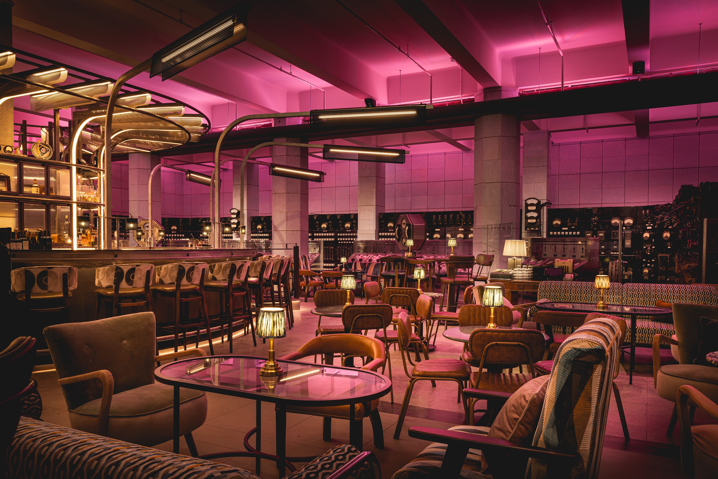 Chic semi-private hire event venue with pink lighting for stylish gatherings and networking.