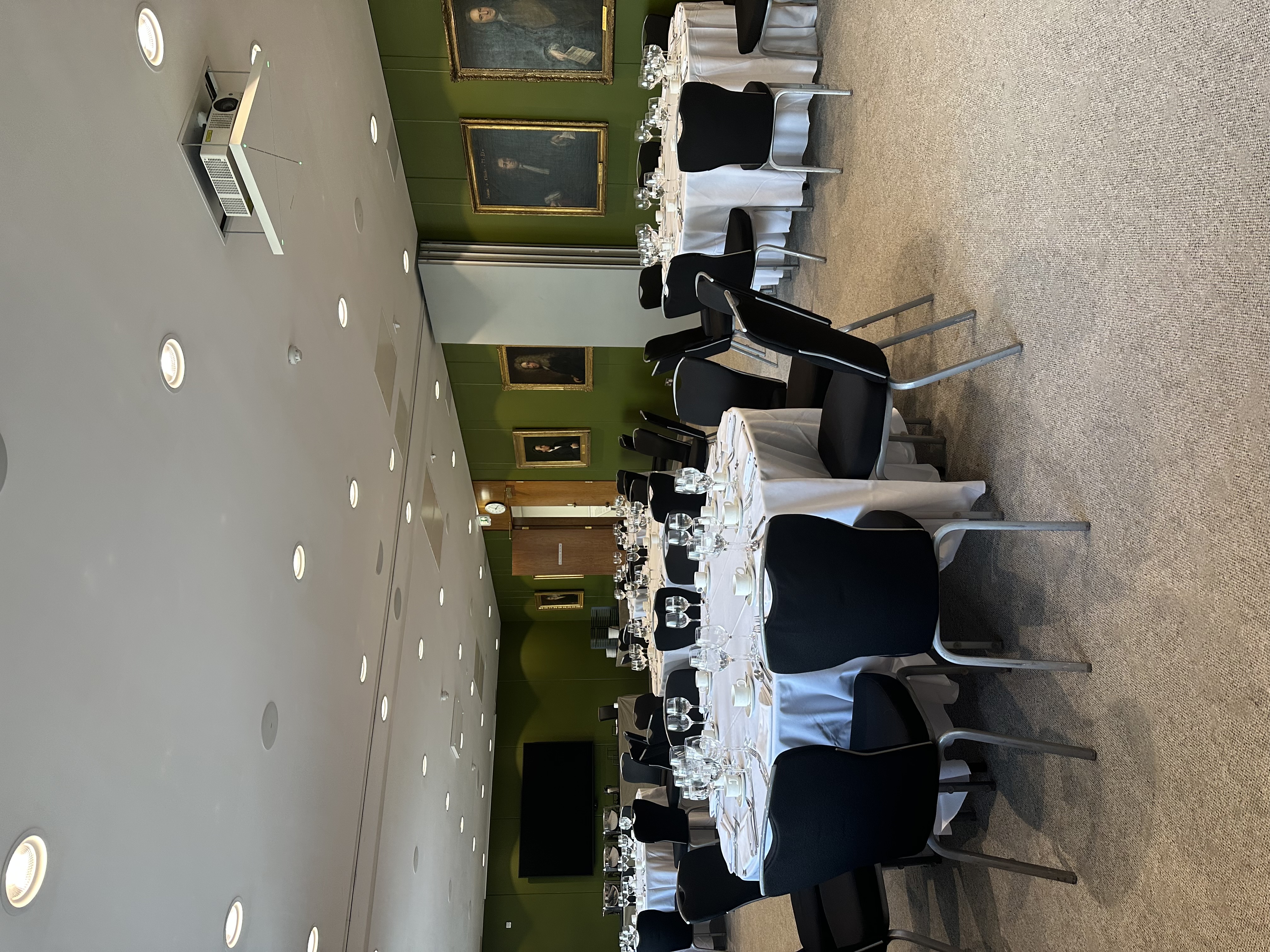Elegant event space at RCP London with round tables, perfect for corporate dinners.