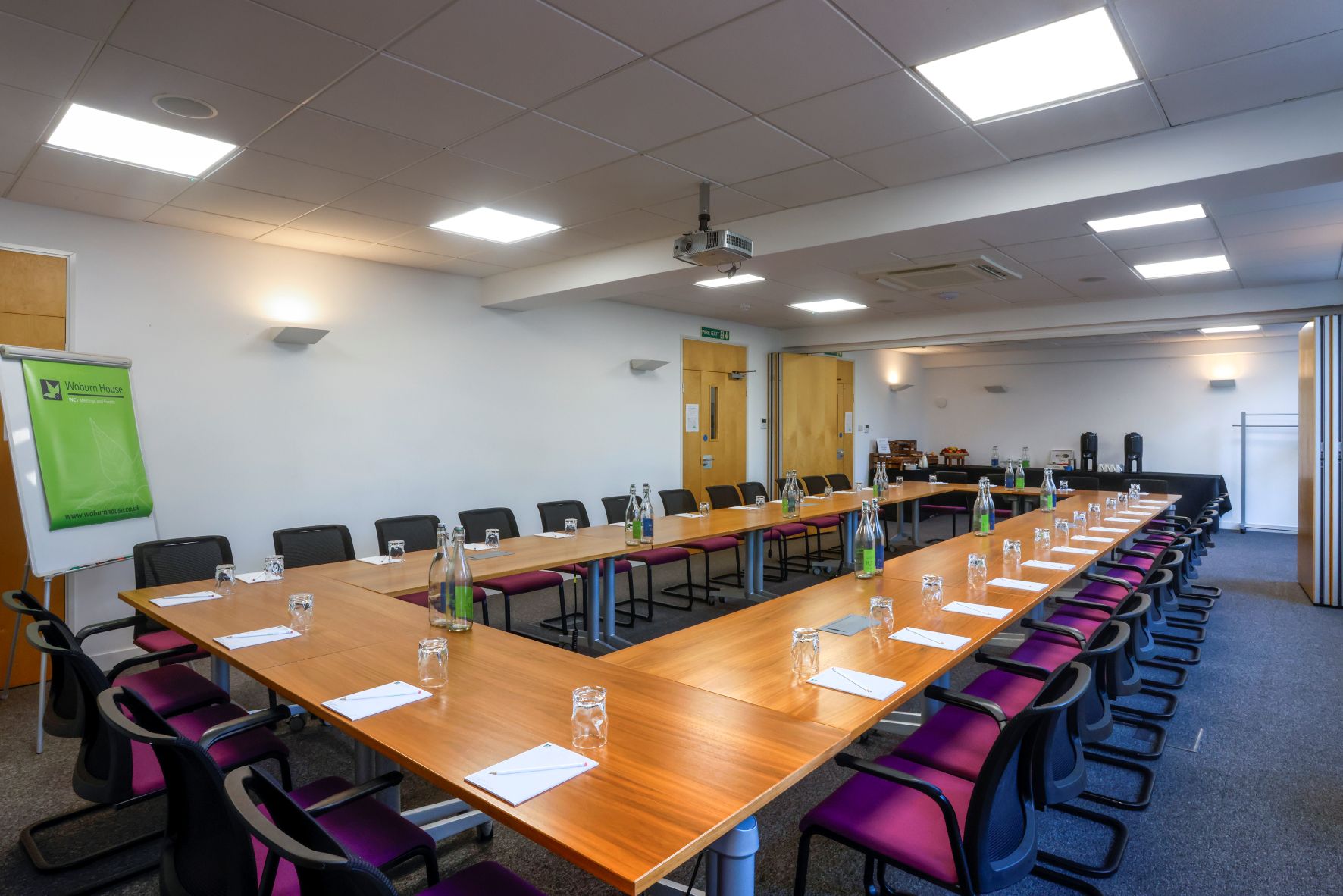 UCEA Boardroom at Woburn House, featuring a long table and ergonomic chairs for conferences.