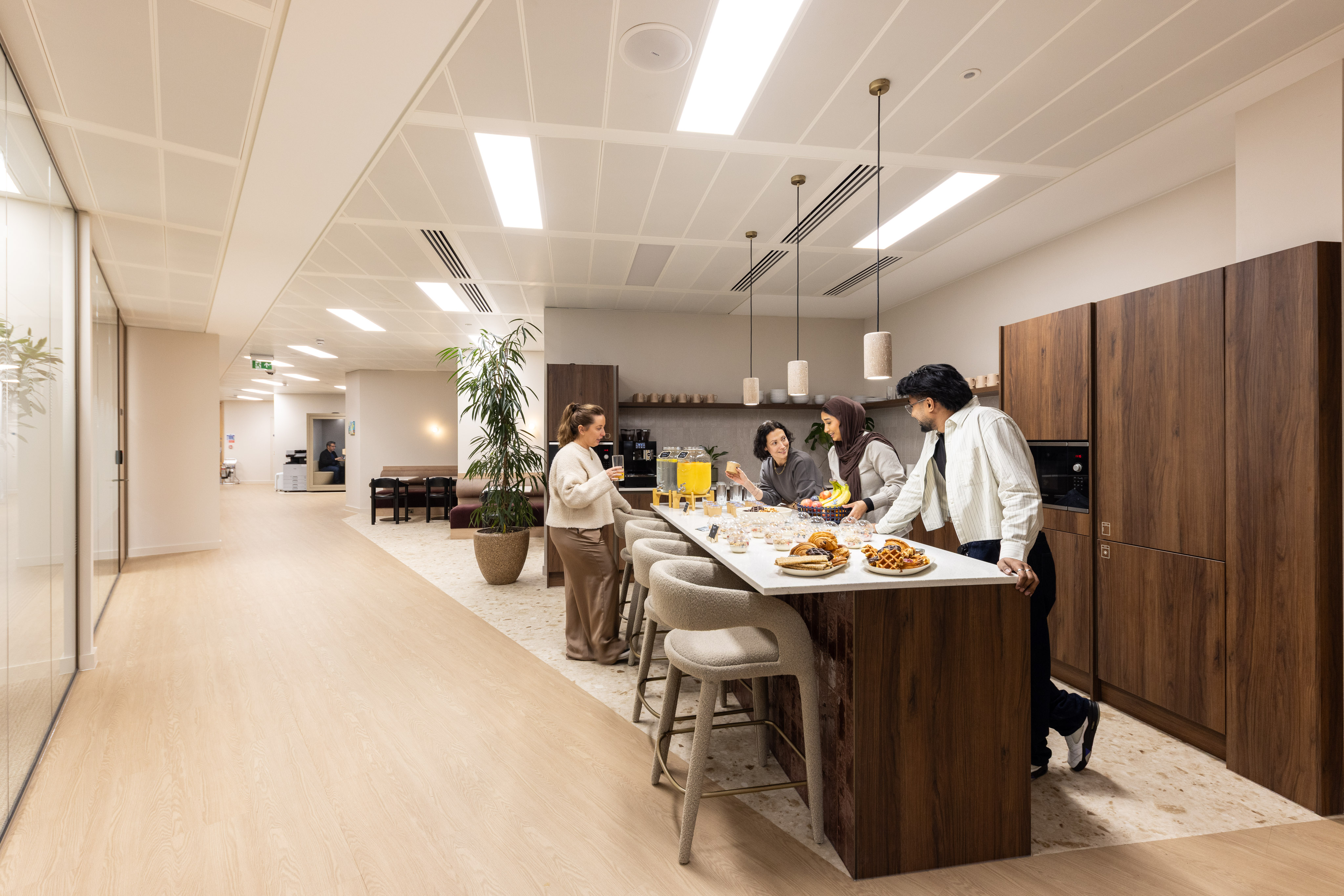 Focus Meeting Room with high-top seating and kitchen island for networking and corporate events.