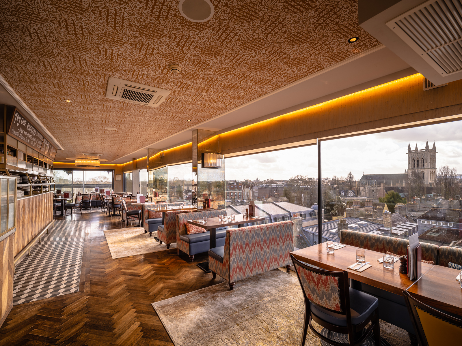 Stylish event space at SIX Brasserie with panoramic views, ideal for meetings and gatherings.