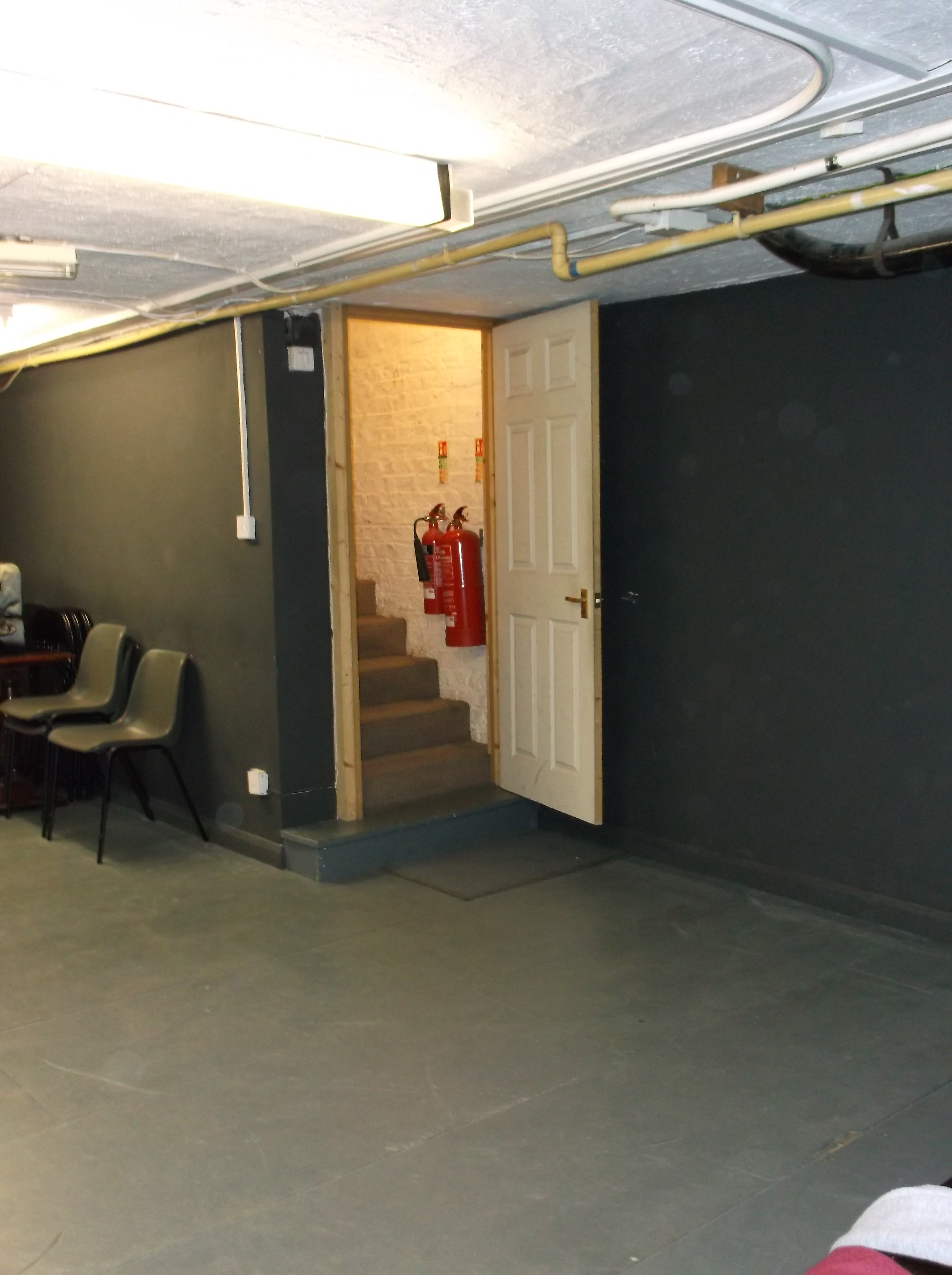 The Basement meeting space at Calder Theatre, featuring flexible seating and safety measures.