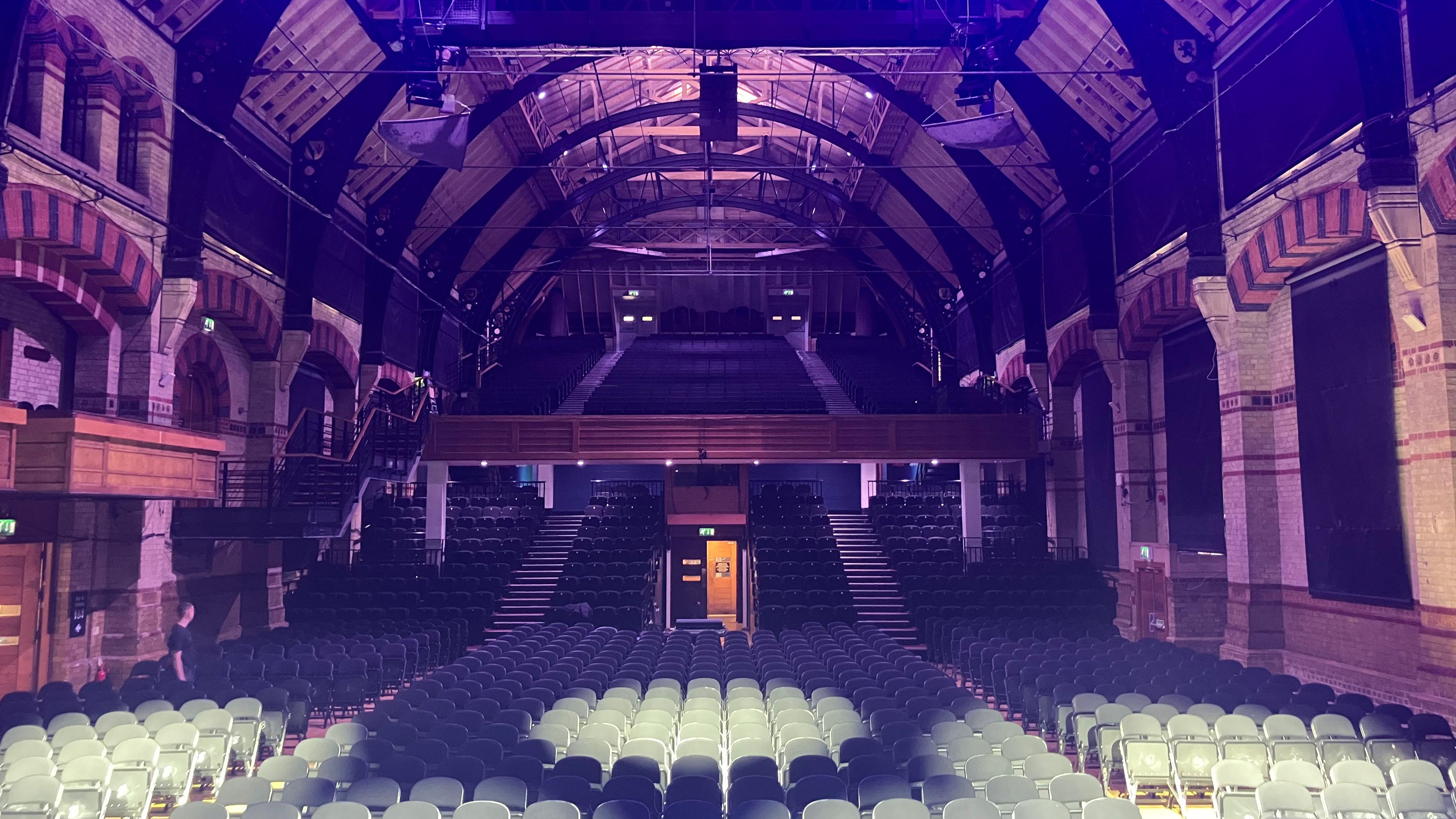 Cambridge Corn Exchange main auditorium with timber trusses for plenary or keynote events.